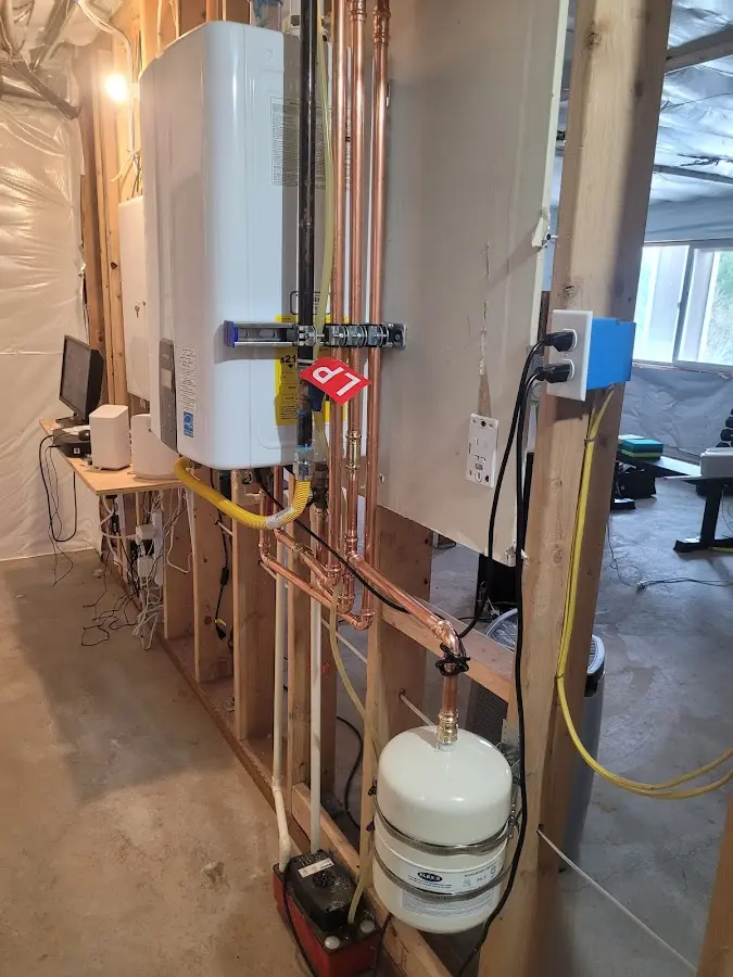 Licensed plumber repairing a kitchen sink in Ford City